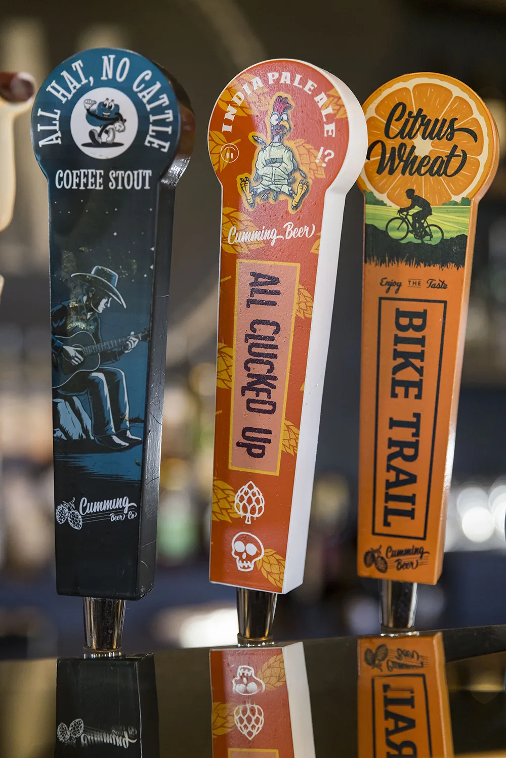 All Hat No Cattle, All Clucked Up, and Bike Trail tap handles on the bar at the Middlebrook Mercantile