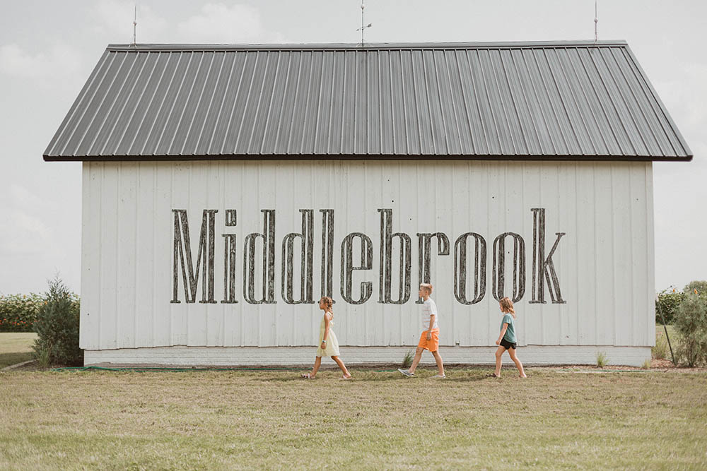 Kids walking past the Middlebrook barn